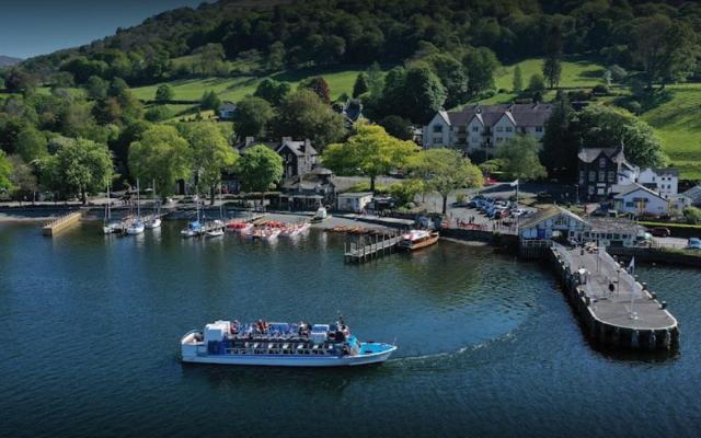 Passenger boat beside Waterhead Pier and the Ambleside waterfront