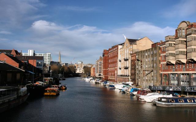 Moored boats and historic waterfront buildings in Bristol Harbour