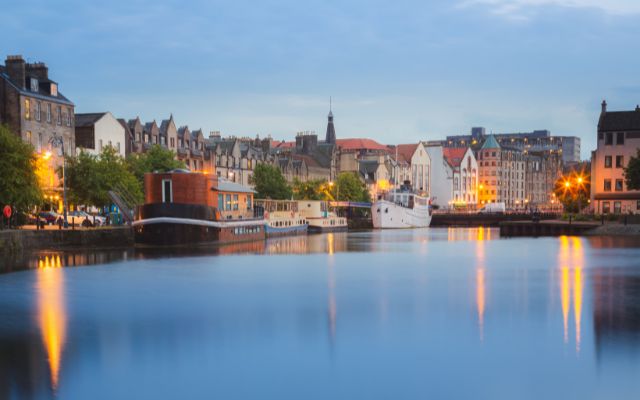 The Shore waterfront in Leith reflected in the water at dusk