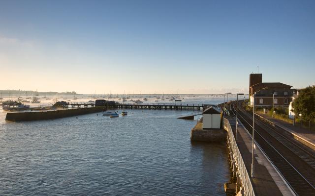 Boats and railway beside the Exe Estuary at Starcross