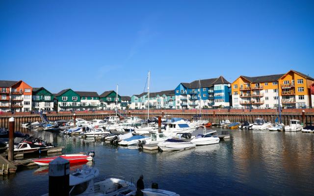 Boats and colourful waterfront buildings at Exmouth Marina