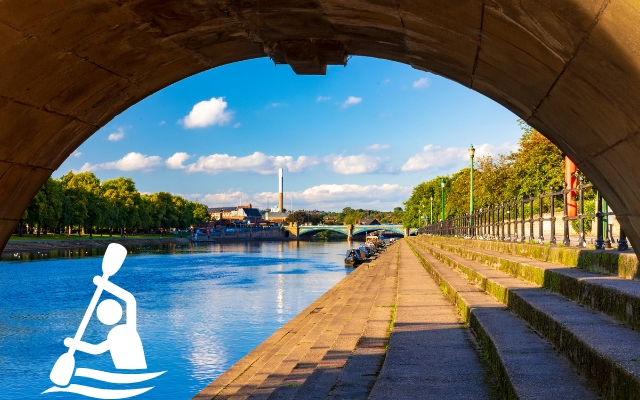 River Trent and riverside path seen beneath a bridge in Nottingham