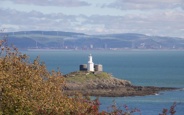 Mumbles Lighthouse above its rocky shoreline