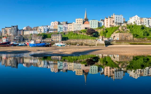 Colourful Tenby houses reflected in the harbour
